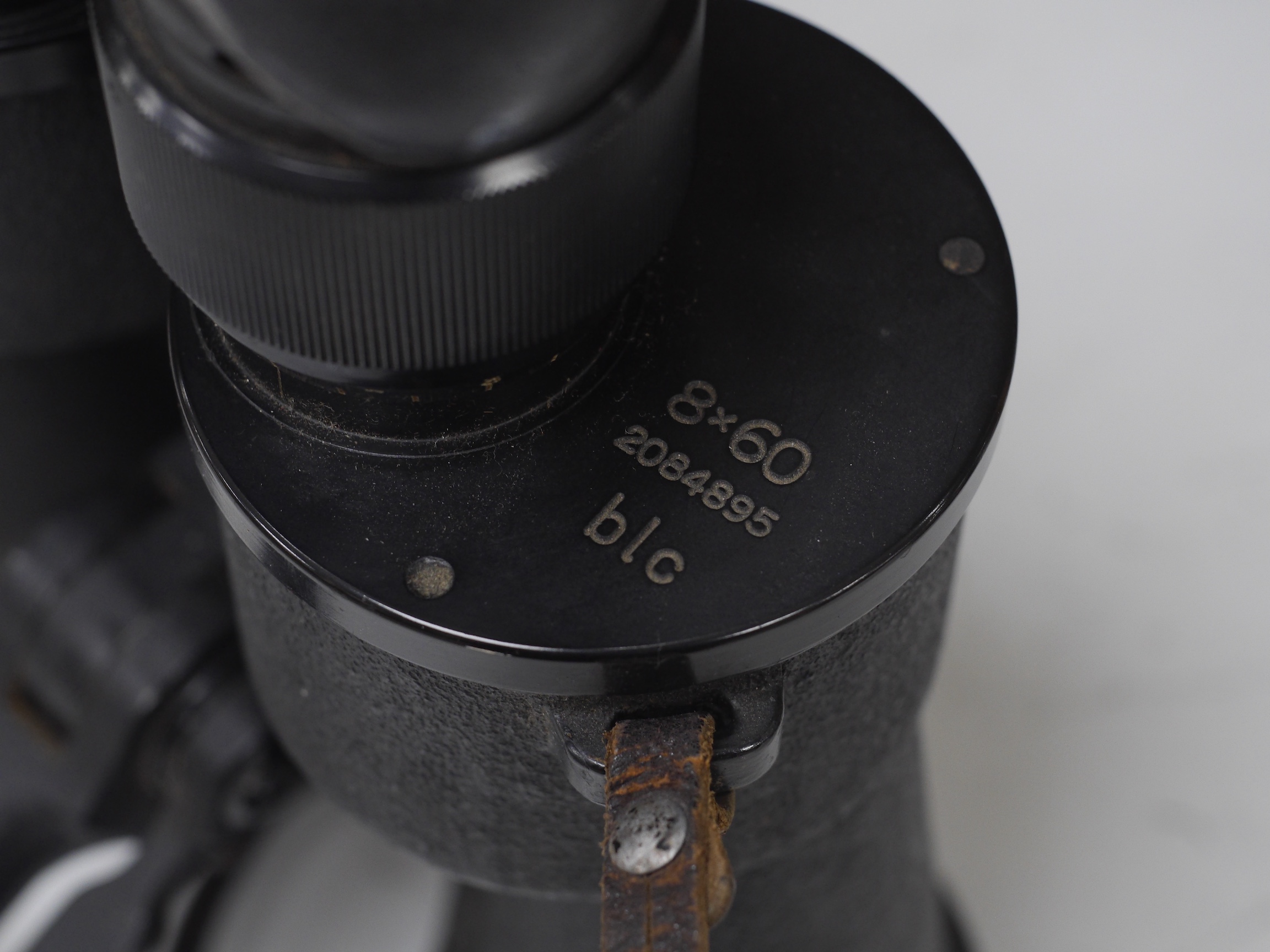 A pair of BLC 8x60 black binoculars, reg. 2084895, with a tripod fitment, 27.5cm log. Condition - fair to good